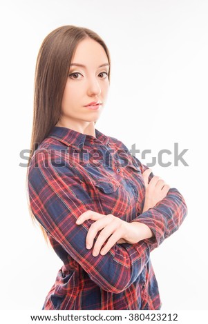 portrait of beautiful serious young woman crossing her hands