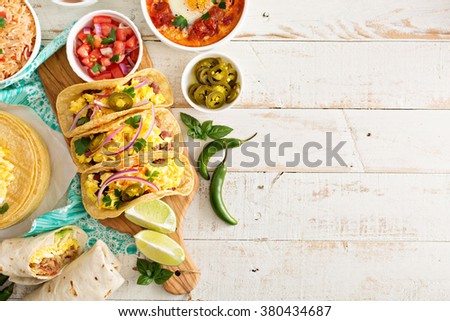 Variety of colorful mexican cuisine breakfast dishes on a table Royalty-Free Stock Photo #380434687