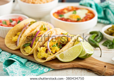 Tacos with  eggs for breakfast and variety of mexican dishes Royalty-Free Stock Photo #380434750