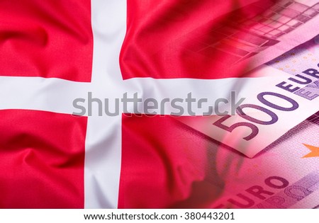 Flags of the Denmark with euro banknotes.