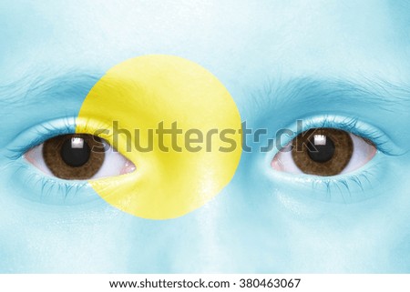 human's face with palau flag 