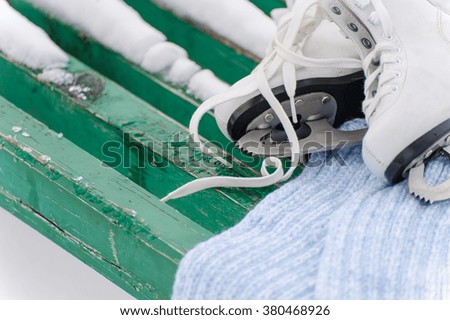 Figure skates in snow close-up