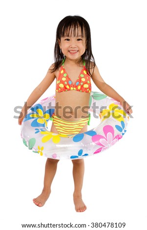 Asian Little Chinese Girl Playing with Swimming Ring isolated on White Background.
