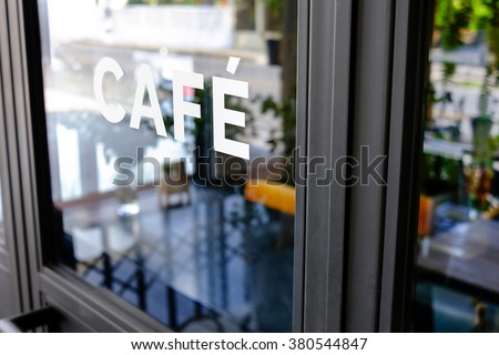 Alphabet cafe word on the window Royalty-Free Stock Photo #380544847