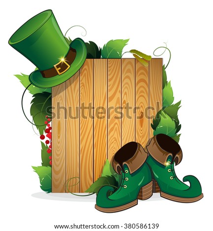 Leprechaun shoes and bowler hat on wooden background. St. Patrick's Day background.
