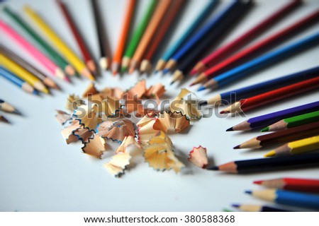 colored pencils on white background. pencils sharpened. More Photos to have colored sawdust from a pencil part of the picture in the field