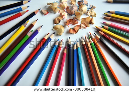 colored pencils on white background. pencils sharpened. More Photos to have colored sawdust from a pencil part of the picture in the field