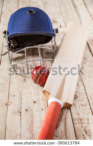 Cricket Equipment on wooden table