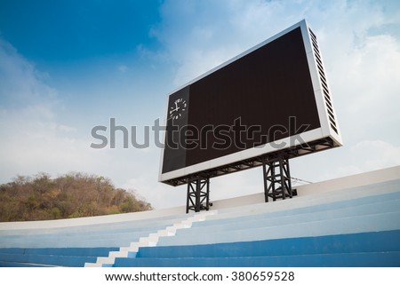 Blank scoreboard in outdoor stadium Royalty-Free Stock Photo #380659528