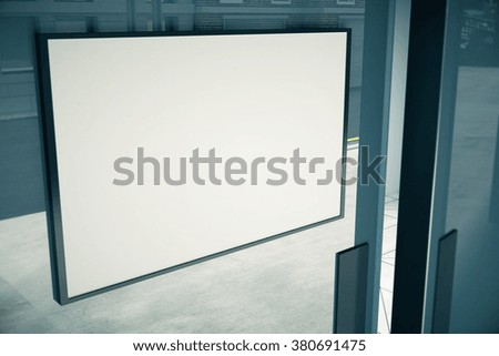 Blank white signboard on glassy door of building, mock up