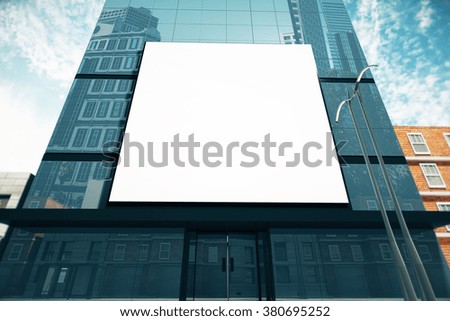 Big blank billboard on glassy business center at sunny day, mock up 3D Render