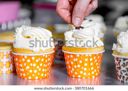 chef making cupcakes with vanilla cream