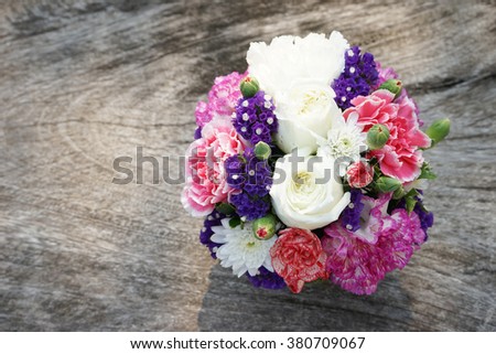 beautiful bouquet of flowers on wooden table
