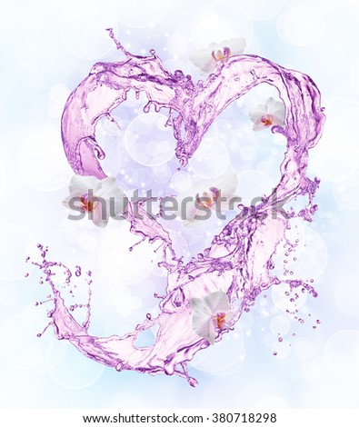 Heart from water splash with bubbles. Bokeh background
