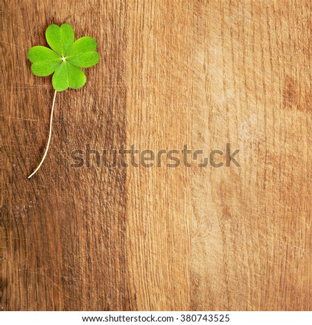 a clover on wooden desk