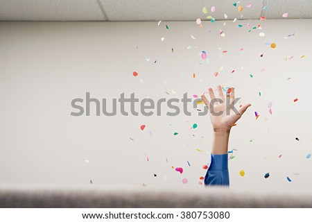 Businessman throwing confetti in the air Royalty-Free Stock Photo #380753080