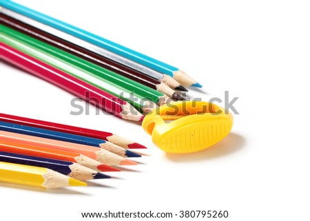 pencil sharpener and a set of colored pencils for drawing