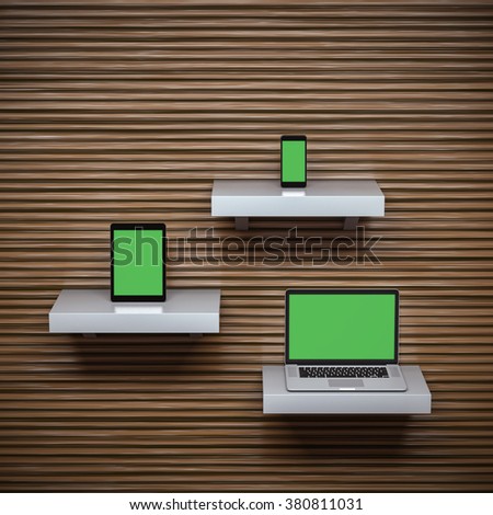 Responsive mockup of a laptop, digital tablet and smart phone on separate shelves. Clipping paths for all displays included.