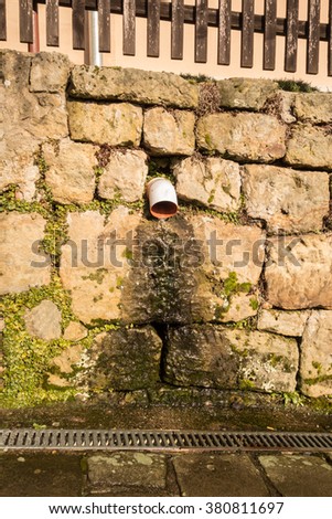 Drain pipe, water drain, Sandstone wall