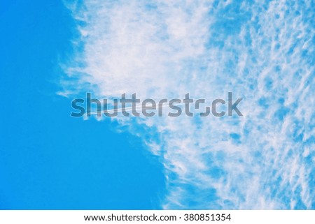 Sky with clouds and path of the aircraft