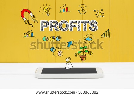 Profits concept with smartphone on yellow wooden background
