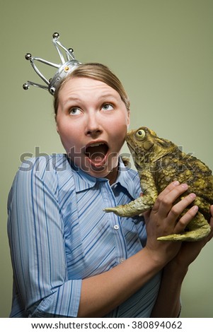 Office worker holding a frog