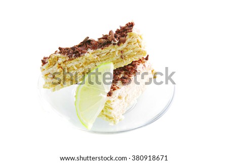 light cake and lemon on transparent saucer