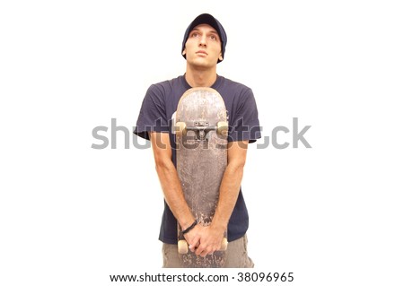 skater posing with a skateboard on white background
