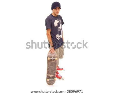 skater posing with a skateboard on white background