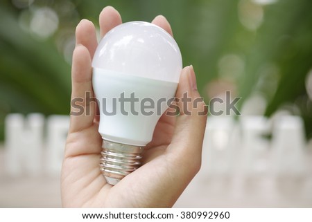 Hand Holding white light bulb idea concept , business concept , business idea, strategy concept