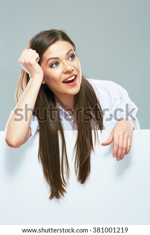 Smiling business woman  with long hair on white  sign board. Young female model smile with teeth.