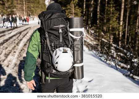 Man hiking outside in sunny winter mountains. The Tatra Mountains