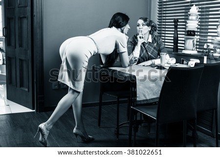 Woman whisper something to friend