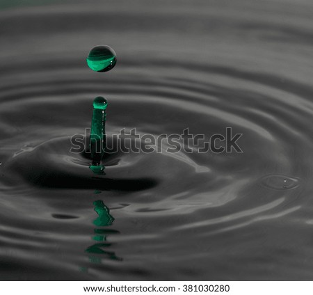 Green droplet of water