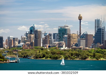 Dramatic view at Sydney city urban skyline from Western Plains with blue sky and clouds on a bright day