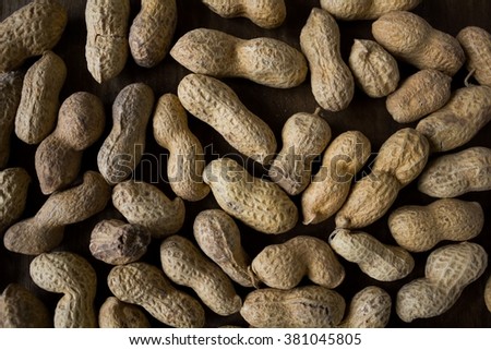 Peanuts texture. Peanuts background. Nut texture. Dry nut. Dry nut and shell. Nutrition food. Peanuts seed. Organic food. Raw nut texture. Vignette peanuts texture. Brown peanut. Peanut material. Nuts