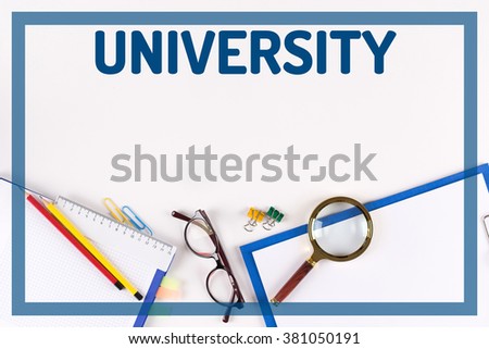High Angle View of Various Office Supplies on Desk with a word UNIVERSITY