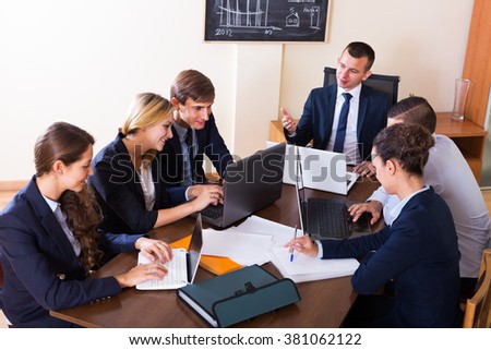 Business meeting of successful team at the office interior  Royalty-Free Stock Photo #381062122
