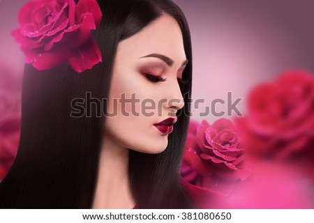 The beautiful girl with flowers of a rose. Beauty Model Woman Face. Perfect Skin. Professional Make-up.Makeup. Fashion Art