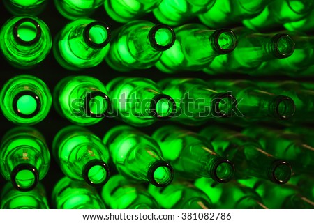 bottles as background green beer texture Royalty-Free Stock Photo #381082786