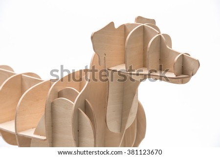 Jack russell terrier's model made of plywood. Studio photo on a white background. Horizontal.