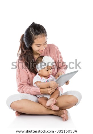 portrait of a Woman with her baby using tablet together isolated over white background