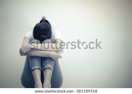 sad woman hug her knee and cry Royalty-Free Stock Photo #381189358