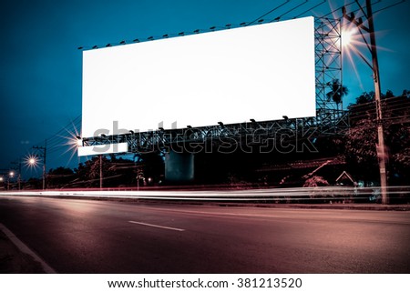 billboard with traffic light and road