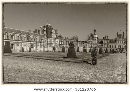 Beautiful Medieval landmark - royal hunting castle Fontainbleau. Palace of Fontainebleau - one of largest royal chateaux in France (55 km from Paris), UNESCO World Heritage Site. Vintage photo.