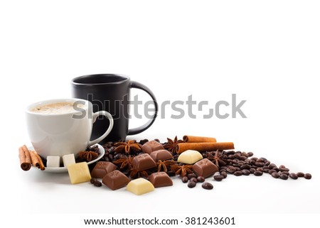 A cup of coffee with cinnamon, sugar and chocolate and star anise Royalty-Free Stock Photo #381243601