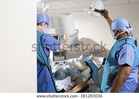 Surgeons with patient