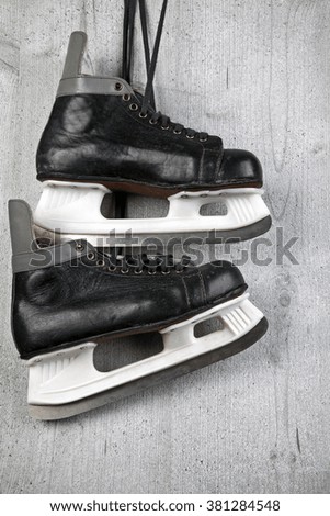 Vintage male ice skate on wood background