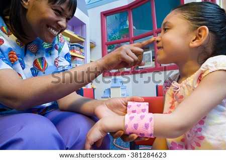 Nurse caring for girl