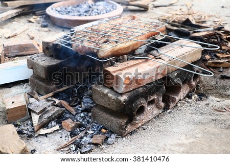 
Beef on barbecue stove with flame in-Thailand.